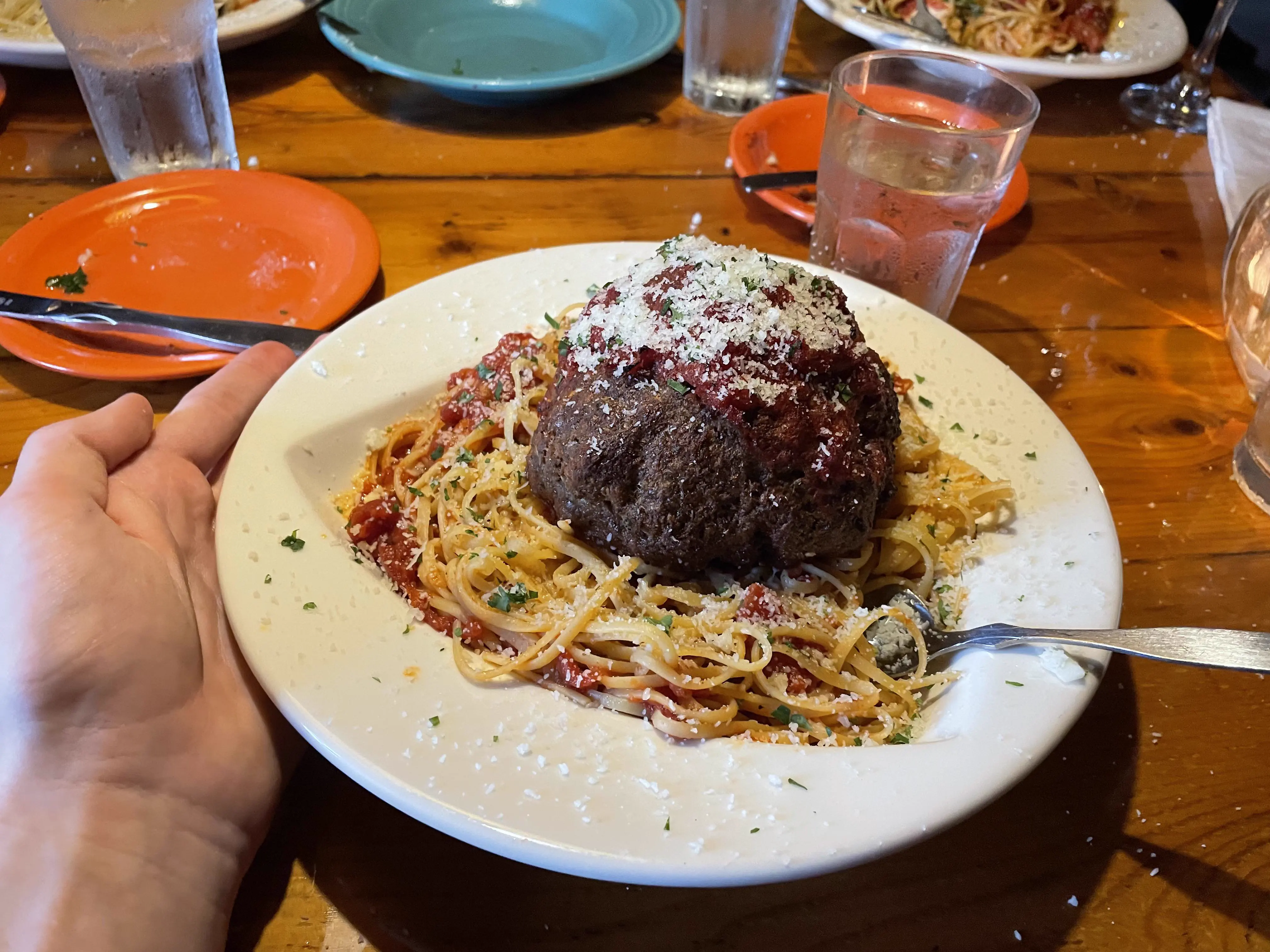 12 Giants That Made Us Rethink Everything 𫣠16 Absolute units of a giant spaghetti meatball with hand and glass for scale